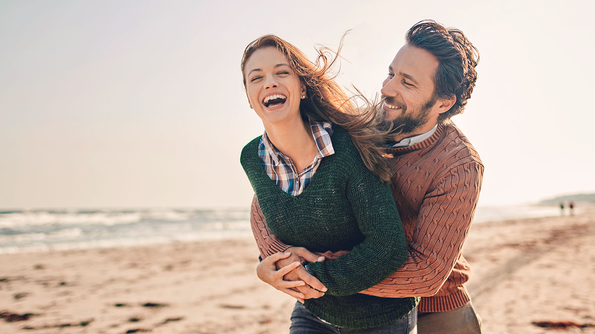 couple laughing on beach